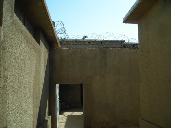 Between the main buildings and the cells